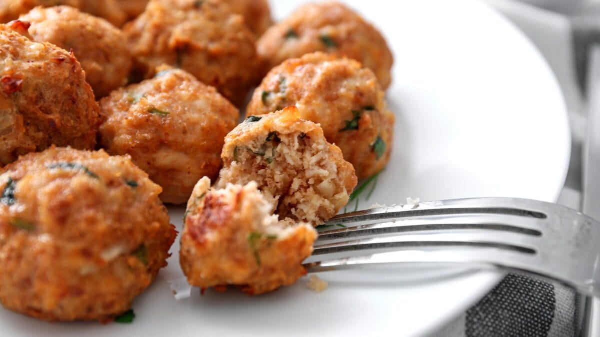 plate of meatballs with silver fork